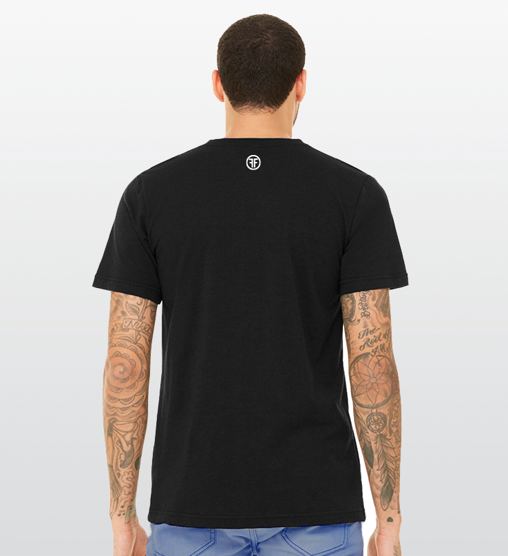 The back of a man in a black t-shirt. There is a white logo below the collar, with two Fs back to back in a white circle.