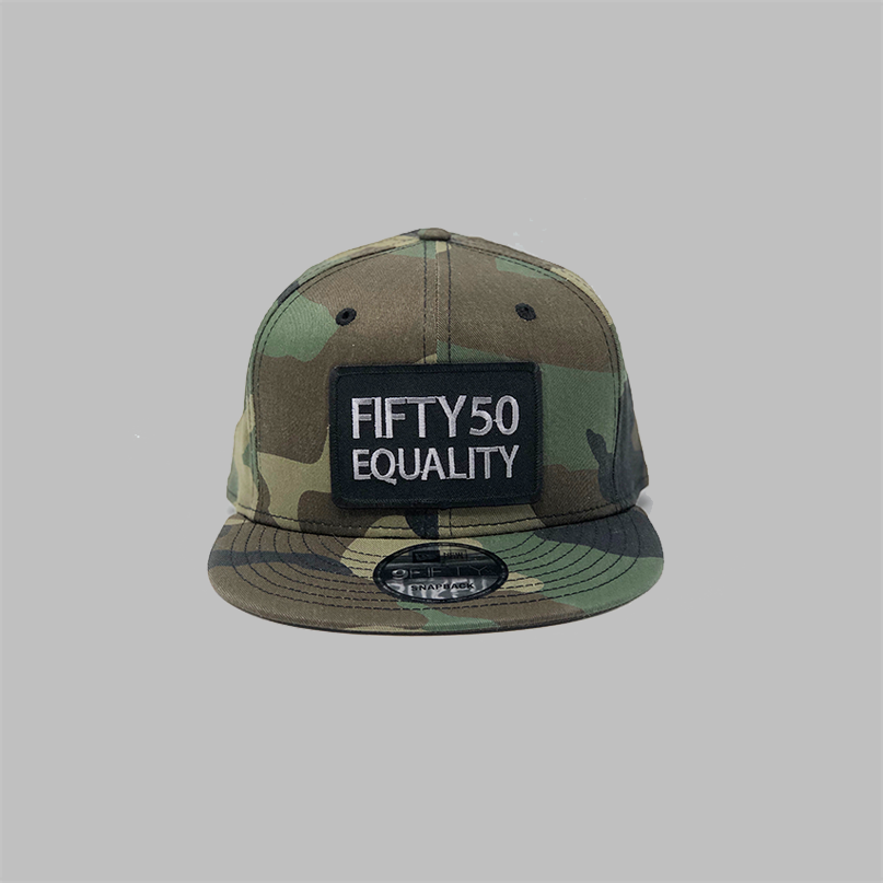 A camouflage, flat bill, snapback equality hat. It shows a sewn on black patch that has the embroidered text Fifty50, Equality, in bold, grey font.