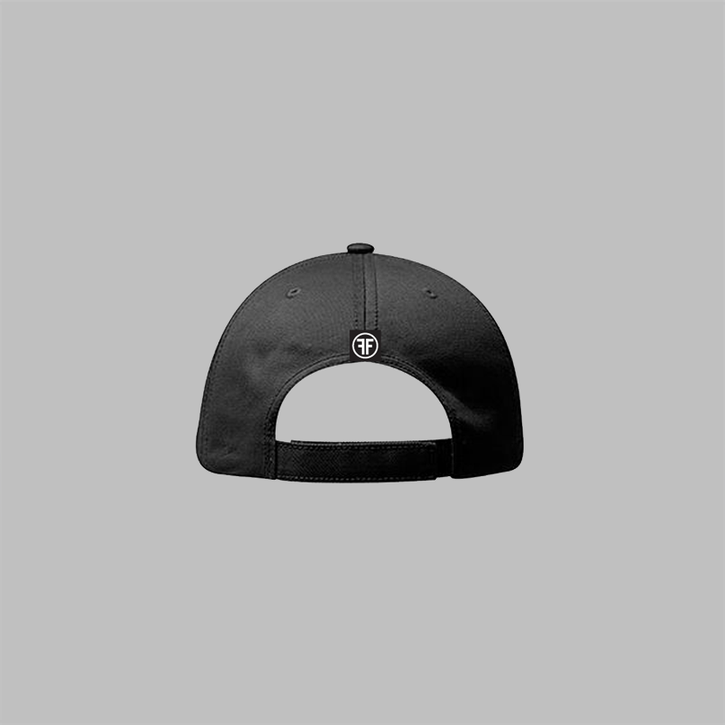 The back of a black dad hat with a velcro closure. A sewn on black tag has a white logo with two Fs, back to back, surrounded by a white circle. 