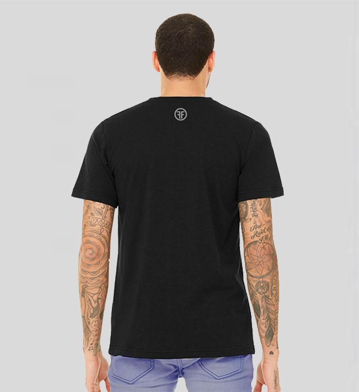 The back of a man wearing a black tshirt. The grey logo is two Fs, back to back, outlined by a circle. 