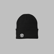 A black beanie with a rolled up cuff. It has a white embroidered logo with two Fs, back to back, outlined by a circle, on the left front.