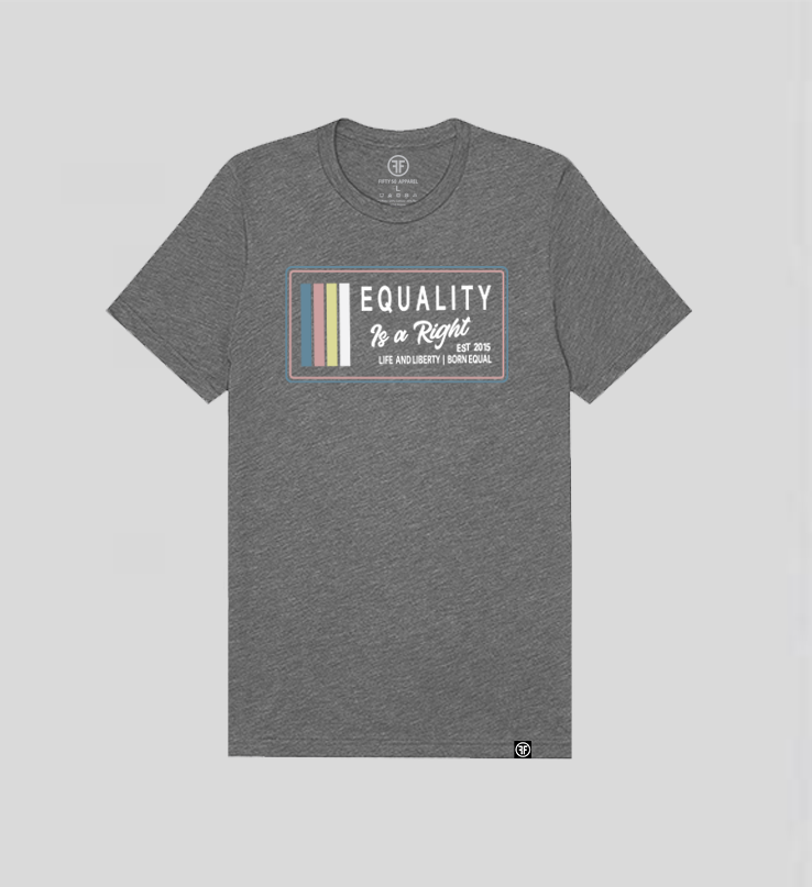 A grey t-shirt with the text, Equality, Life and Liberty, and Born Equal, in white bold font. The text, Is a Right, is in white script font. On the side of the logo are stripes of the colors Slate Blue, Dusty Rose, Bisque Gold, and white.