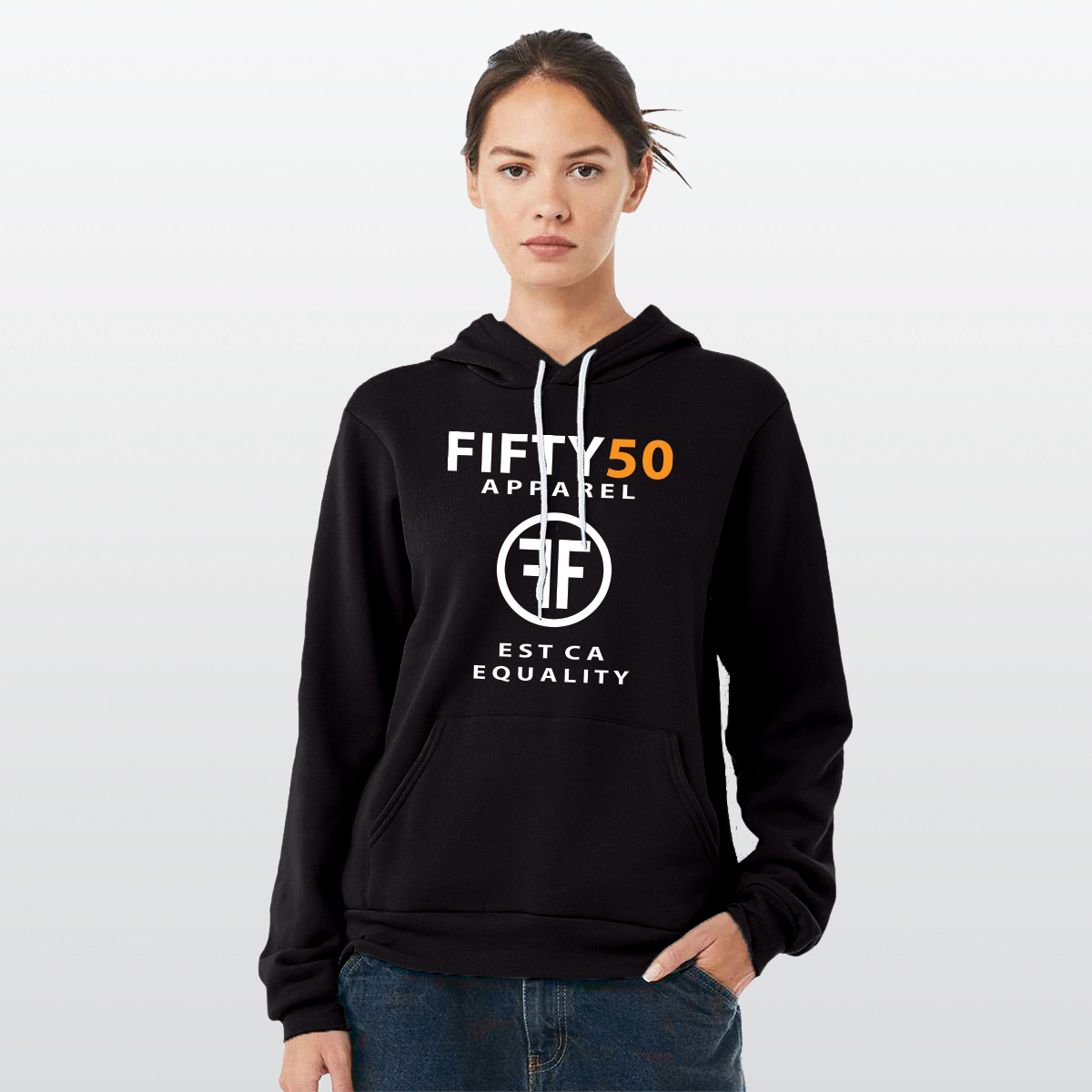 Lady wearing a black lgbt hoodie with the text, Fifty 50 Apparel and Est Ca Equality in white, bold font. The 50 is in orange ink and the center of the logo has two Fs, back to back in a circle.