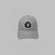 A grey textured linen equality hat with a round black patch. The text reads, Fifty50, Equality, in bold white font, with two Fs, back to back, in the center.