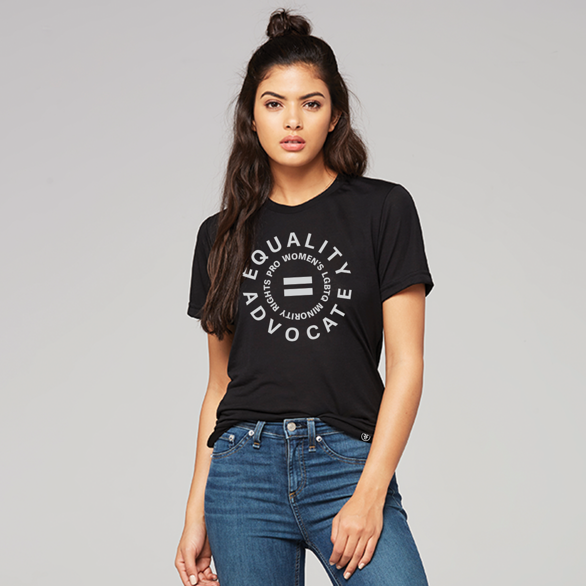 Lady wearing a black human rights tshirt with a light grey logo. An equal sign is in the middle with the text Equality Advocate, in a circle, and pro women's, lgbtq, and minority rights in a smaller circle.