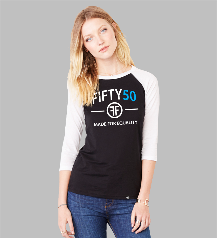 A lady wearing a black baseball t-shirt with white arms and collar.  The text is in white and turquoise and says Fifty50 and Made for Equality.