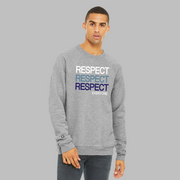 A man wearing a grey unisex political sweatshirt with text Respect Everyone. Respect is written in bold font in white, Slate Blue, and navy blue. 