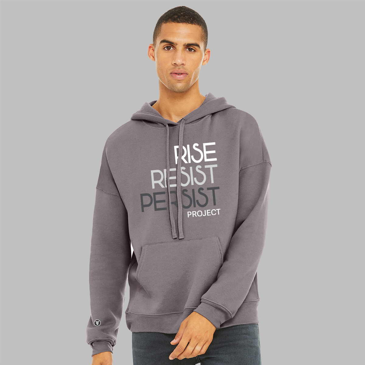 A man wearing a slate purple, unisex anti Trump hoodie. The text says Rise, Resist, Persist Project in white, light grey and dark grey.