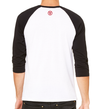 back of a male model wearing the capital raglan by fifty50 apparel which is a white and black raglan with a red logo near the neckline