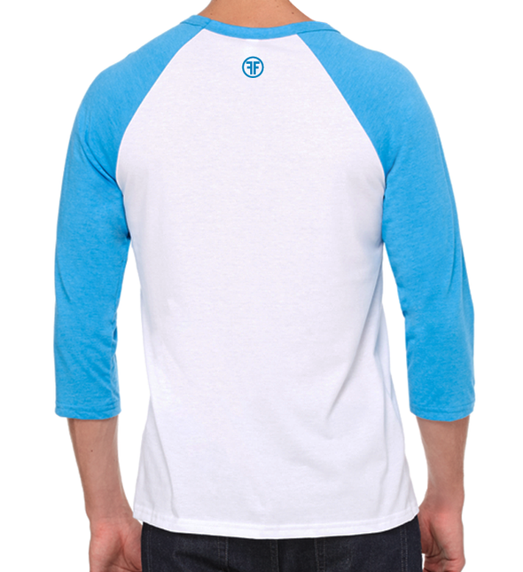 back of a male model wearing the retro equality raglan by fifty50 apparel which is a white and turquoise raglan with a turquoise logo near the neckline