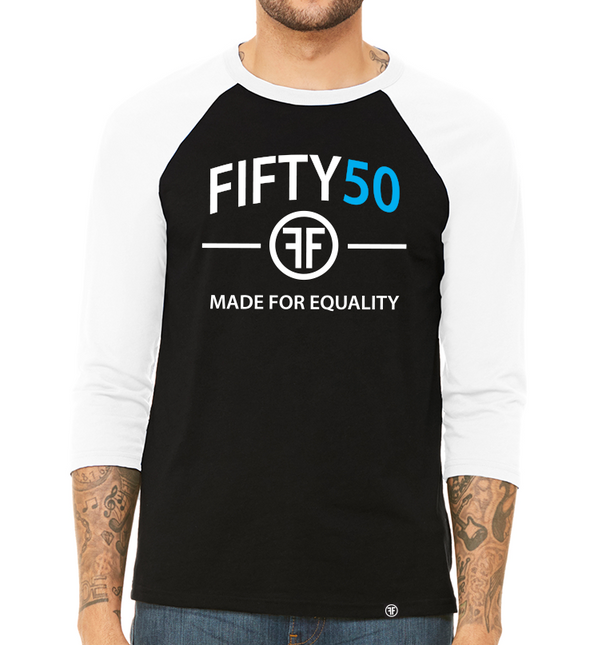 a male model wearing the made for equality raglan by fifty50 apparel which is a black and white raglan with a white and turquoise logo